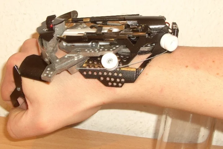 Hobbyist Patrick Priebe's latest creation is a wrist-mounted laser-sighted mini crossbow