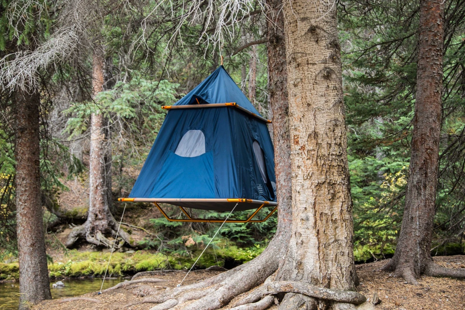The weatherproof Camper tent includes retractable window and door coverings
