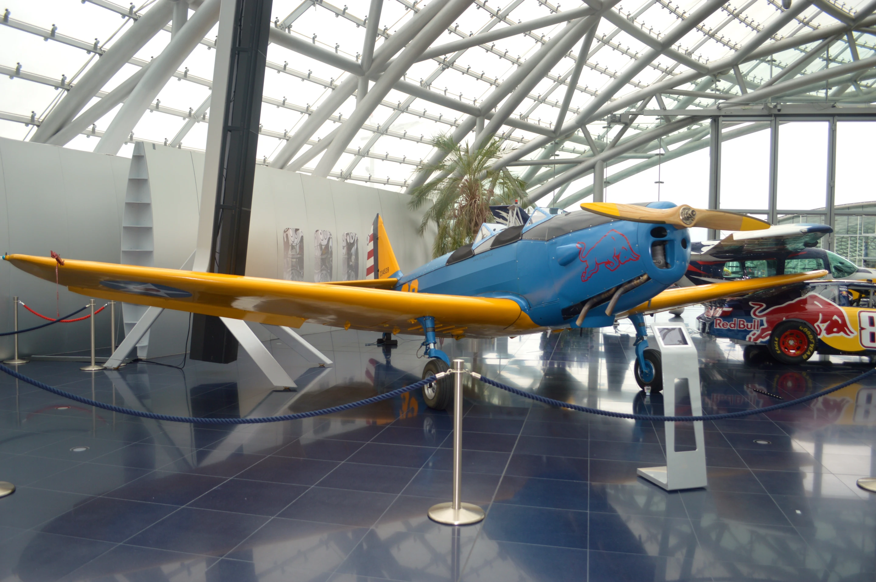 Even in a museum filled with bright aircraft, the PT-19's bright yellow appendages and blue fuselage pop (Photo: C.C. Weiss/Gizmag)