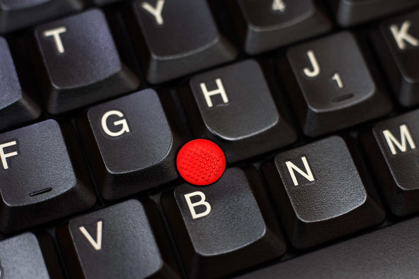The Trackpoint cursor in the IBM Thinkpad series allowed for mouse use in tight spaces like airplane tray tables
