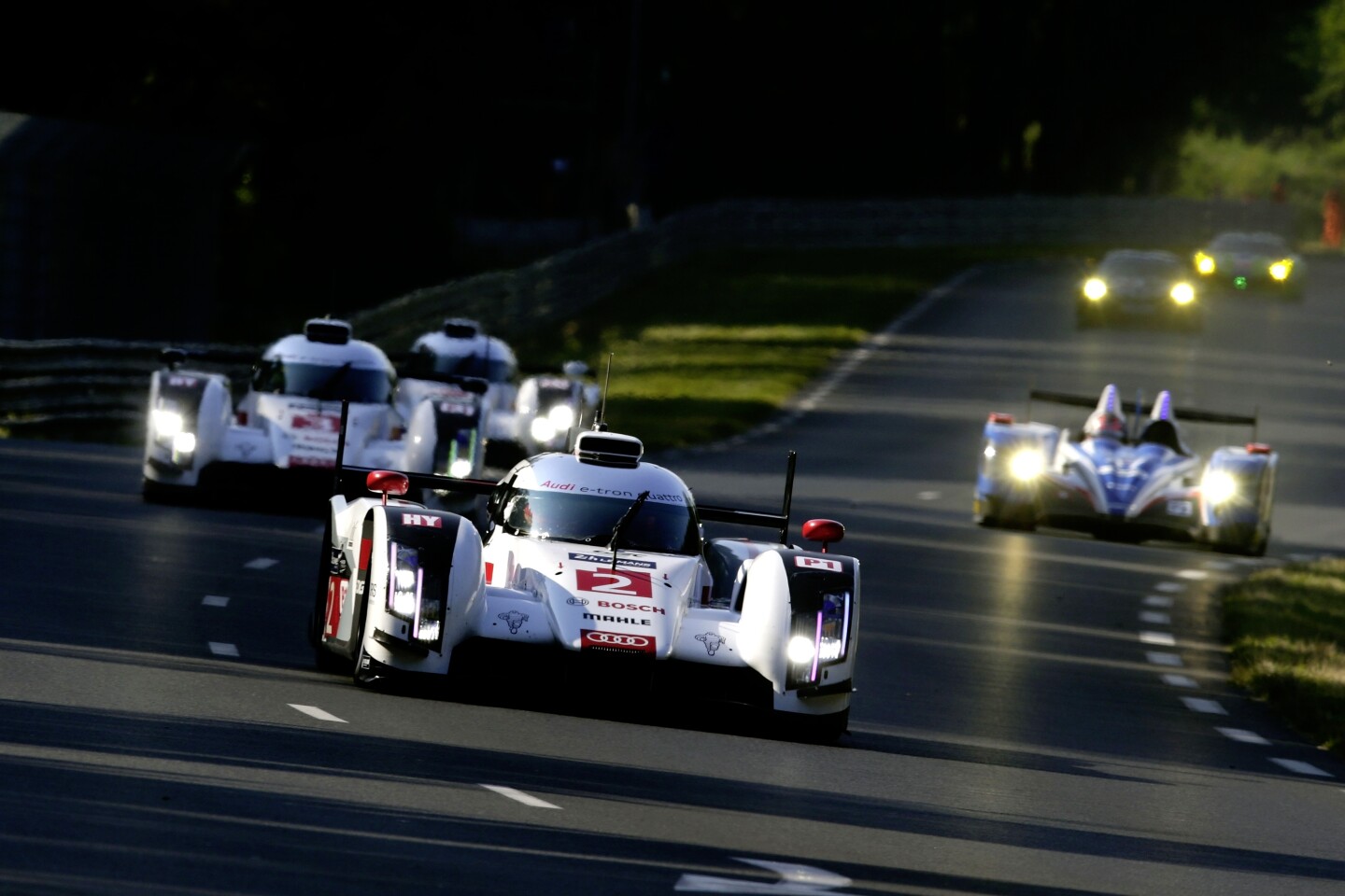 The three Audi cars at speed