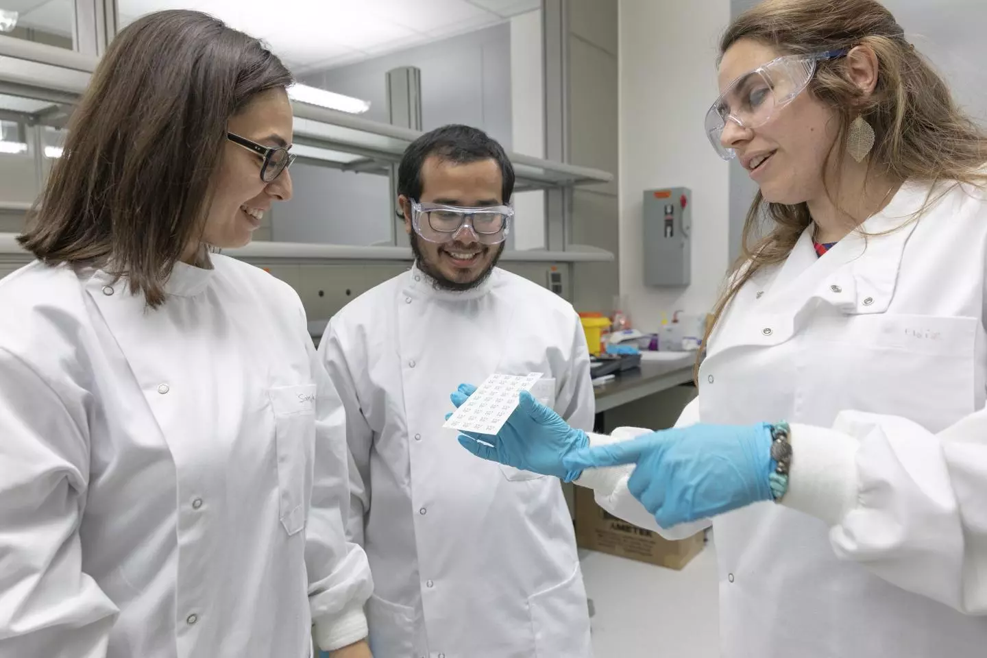 Sahika Inal, Shofarul Wustoni and Eloise Bihar (l-r) inspect a set of the inkjet-printed sensors