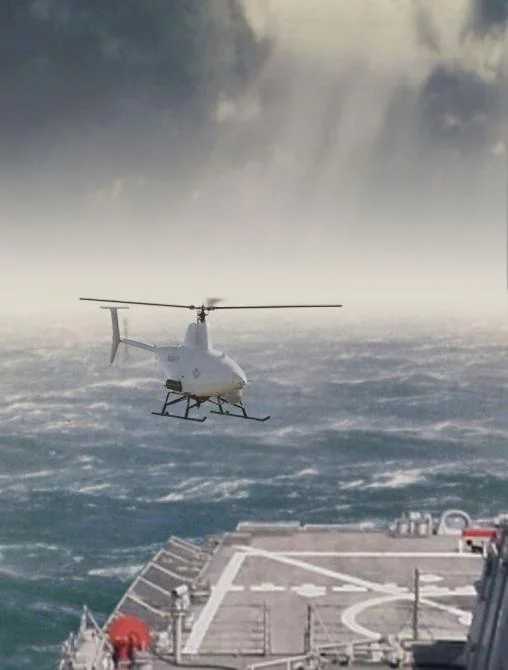 The RQ-8A Fire Scout illustrated landing at sea
