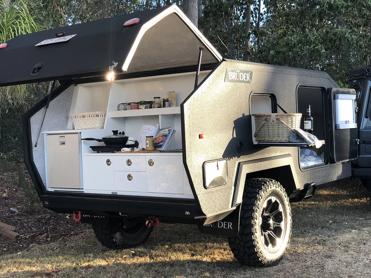 The tailgate kitchen offers plenty of work space, and if you need extra, the two drop-down storage compartment doors double as tables