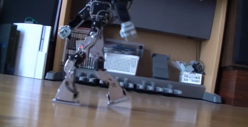 Masahiko Yamaguchi's modified KHR-3HV humanoid walks more like a human – note the trailing leg lifts off at its "toes"