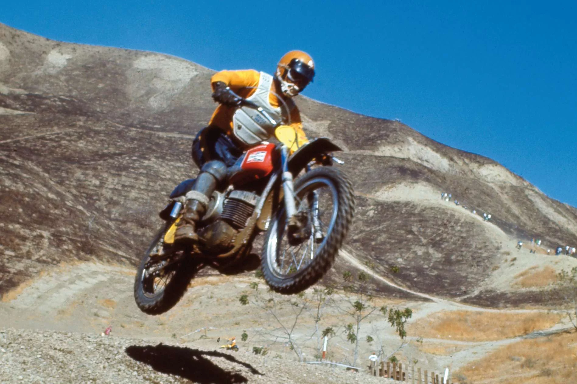 Swedish-born Bengt Åberg spent his whole life pioneering new motorcycle adventures. He was one of the first to follow the money from Europe to America, returning at the peak of his career to win the World 500cc Motocross World Championships in 1969 and 1970. In 1968 he was part of the Swedish team that won the Trophée des Nations and he was a member of the Swedish teams that won the Motocross des Nations in 1970, 1971, and 1974. He was a member of the Husqvarna factory racing team from 1969 to 1973 and the Bultaco factory racing team from 1974 to 1976. Having pioneered two-strokes in American racing, he then set out to achieve the opposite, competing in the World Championships against all the two-strokes on a four-stroke Yamaha XT500 built in collaboration with former world champions Torsten Hallman and Sten Lundin.Åberg rode the bike to a victory in the first moto of the 1977 500cc Luxembourg Grand Prix though he finished the season ranked ninth in the final world championship standings. Though he finished his international career in 1979, he never stopped racing at a local level, and in 1995, he won the Swedish ice speedway national championships. Having a bike that was raced by Bengt Åberg is almost as significant as a bike raced by Steve McQueen. Aberg is one of the all-time greats of motorcycle racing.