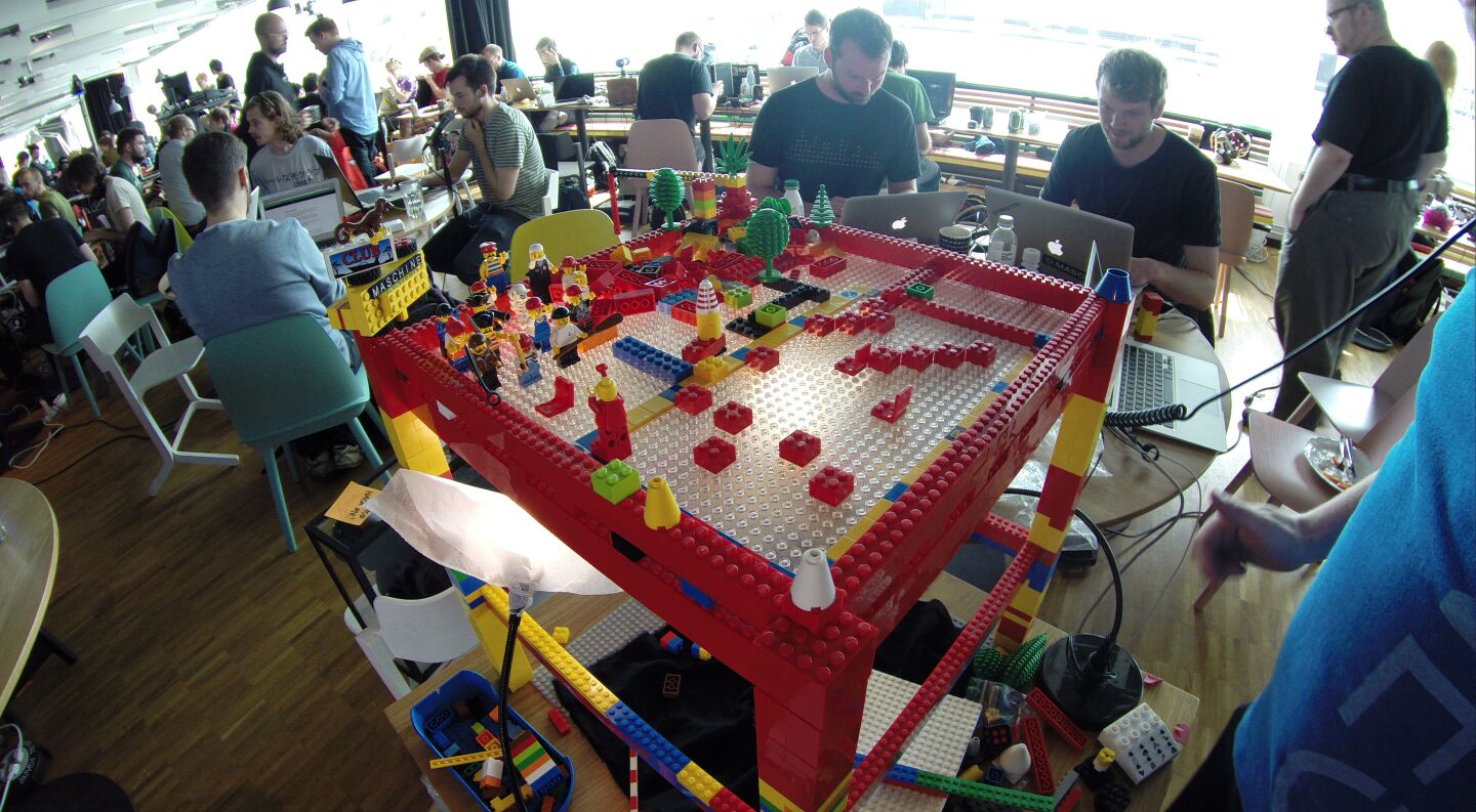 A standard webcam is mounted underneath the transparent baseplate, and the image is processed by a Python Script using the OpenCV Library to track the bricks up top