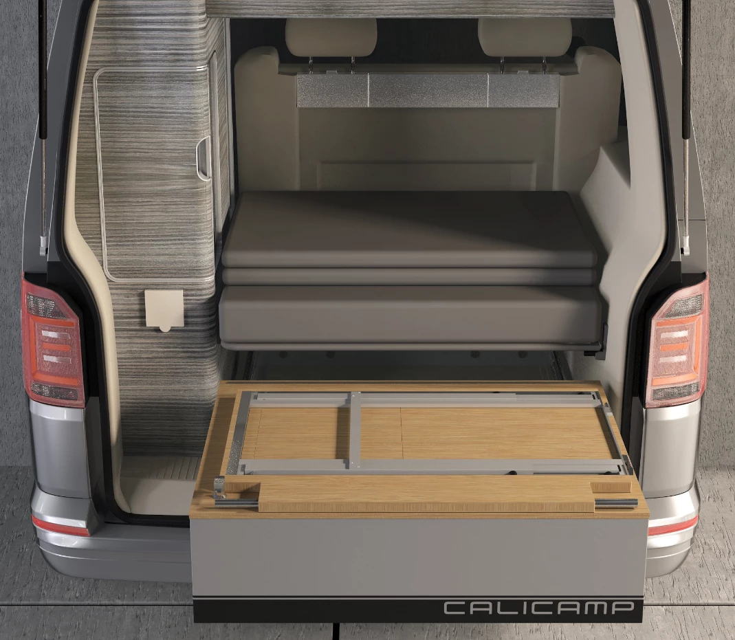 The kitchen frame folds neatly atop the storage drawer during transit