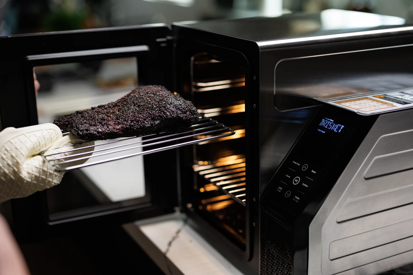 SmoqeX features four grilling racks