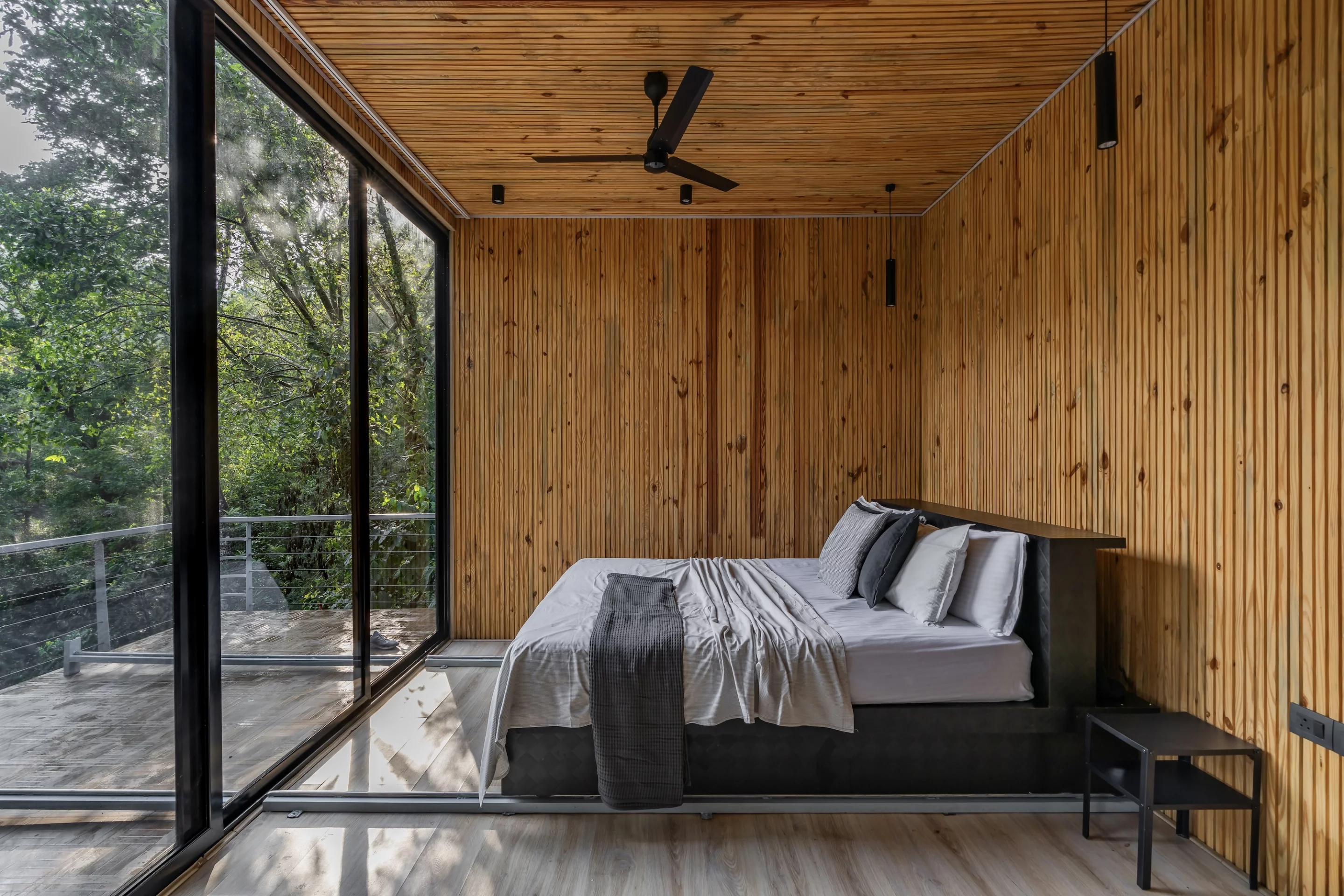 Reflections' interior features a tasteful decor with wooden ceiling and walls, putting the focus on the view outside