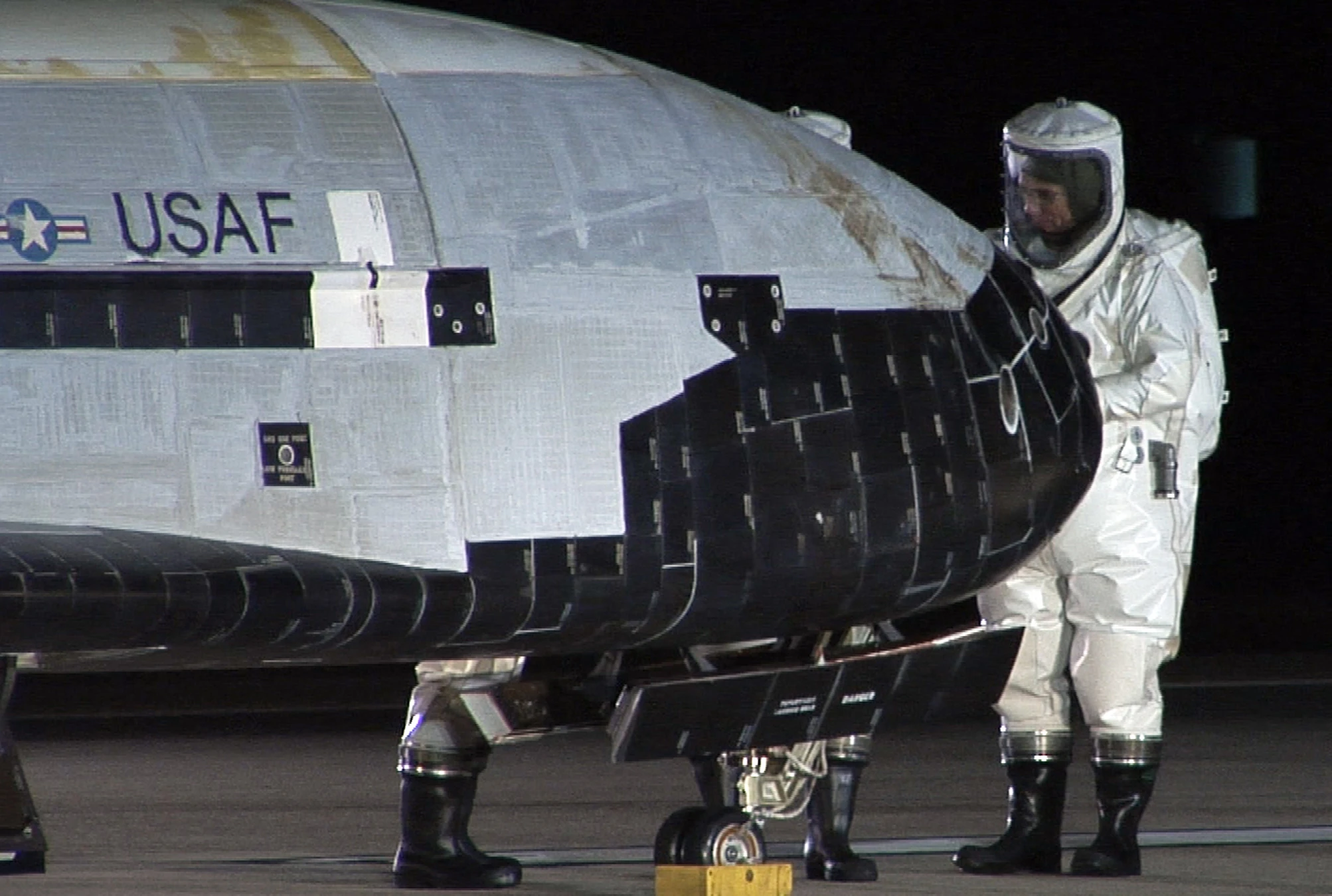 Technician checking X-37B after return from space (Image: USAF)