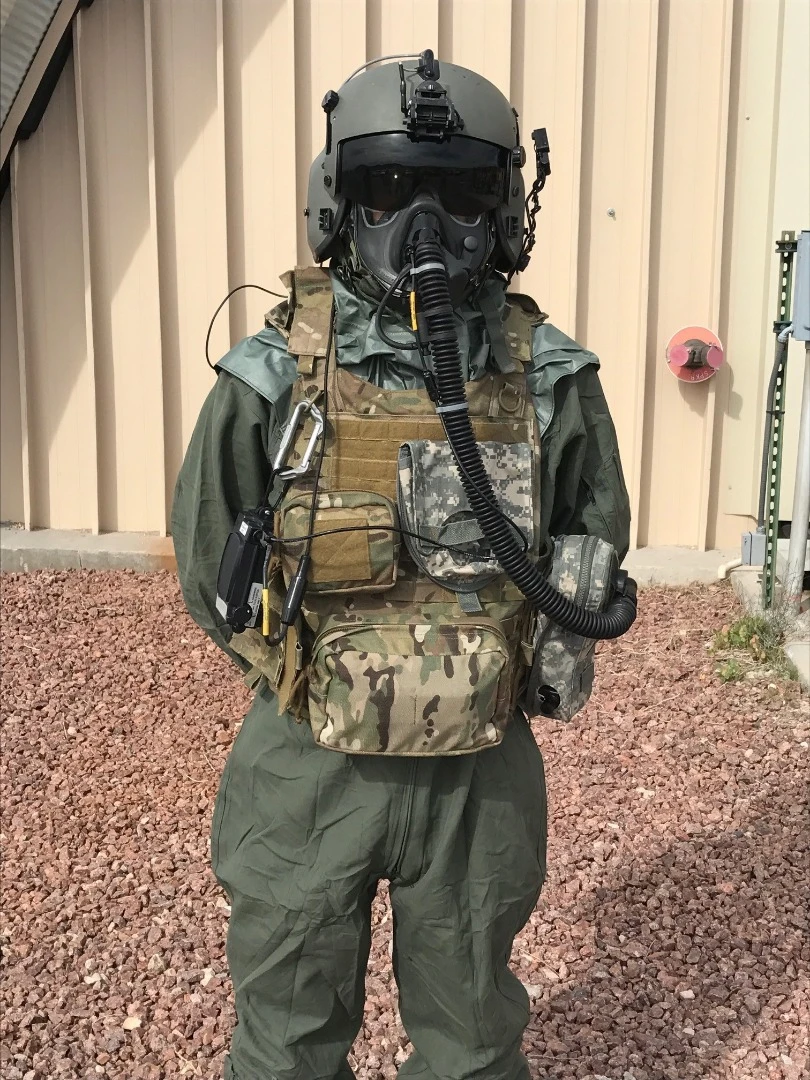 An Airman demonstrates the Joint Service Aircrew Mask - Rotary Wing mask