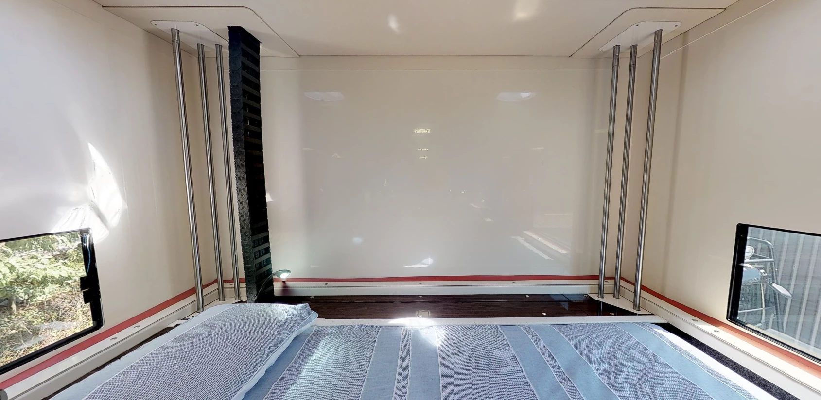 Roof-raising hardware visible at the rear of the upstairs bunk room