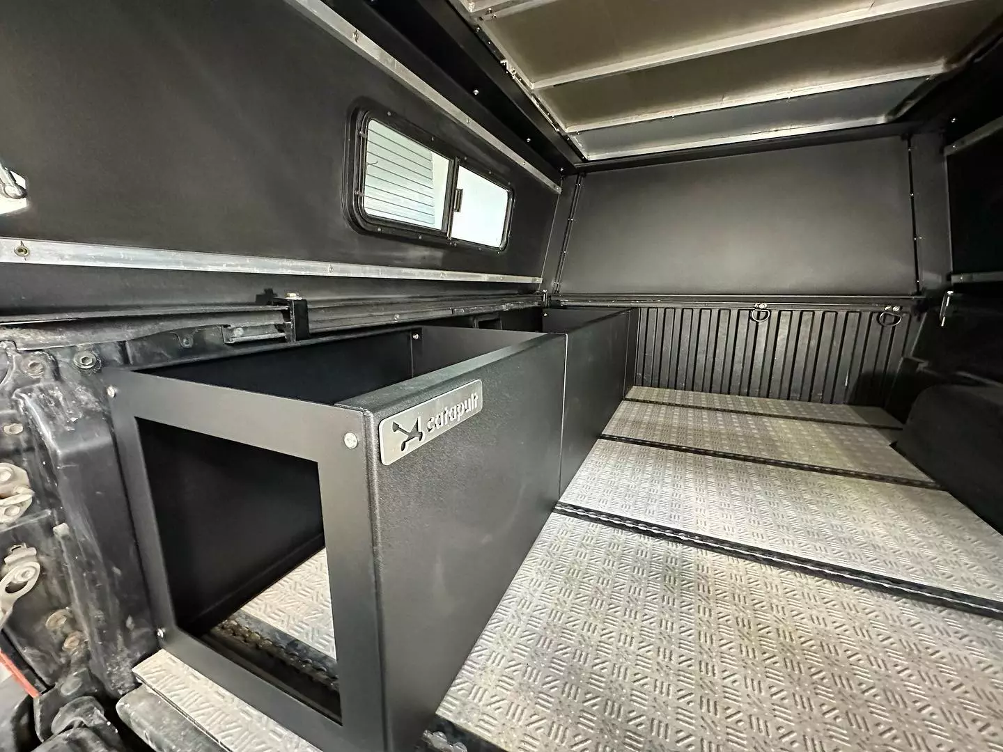 Catapult is gradually building out its module ecosystem, and one of its first pieces is a bench/storage box that extends over top the wheel wells