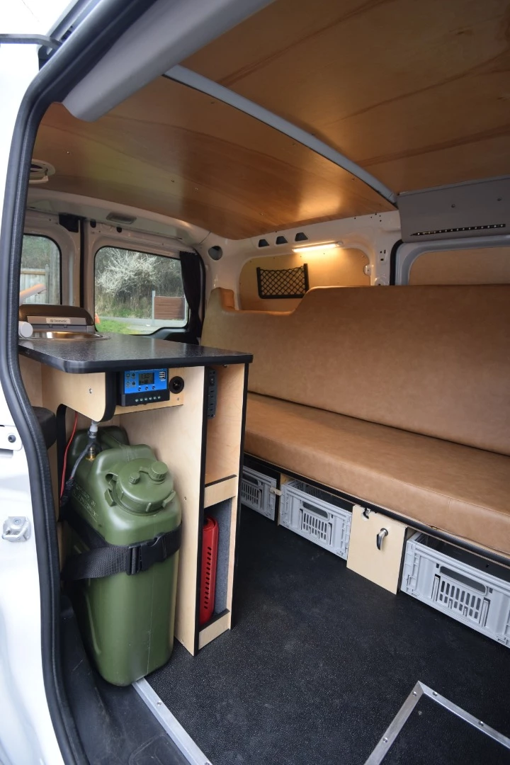 It's not the prettiest conversion out there, but it's priced about as low as we've ever seen for a camper van with bed, kitchen and electrical