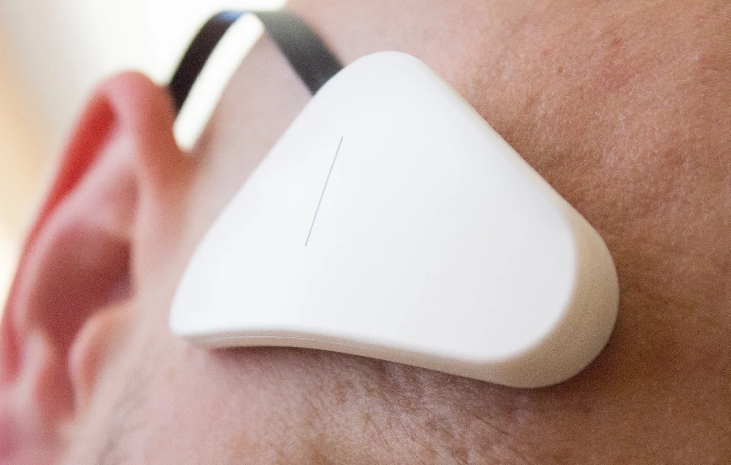 The Thync module, which attaches to your right temple, above your eyebrow