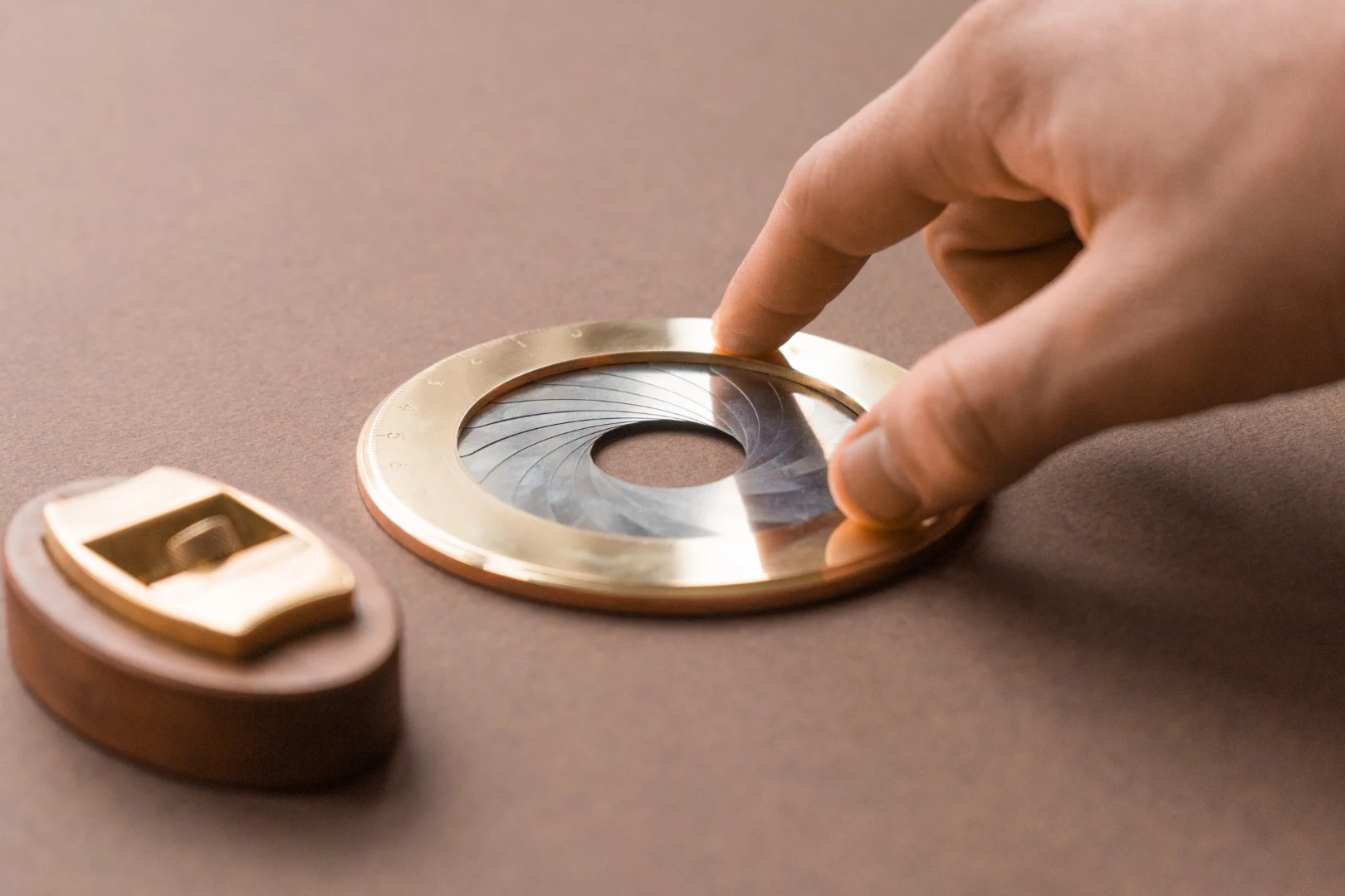 The Iris, shown with its wooden base, alongside the team's first Kickstarter project, the Høvel