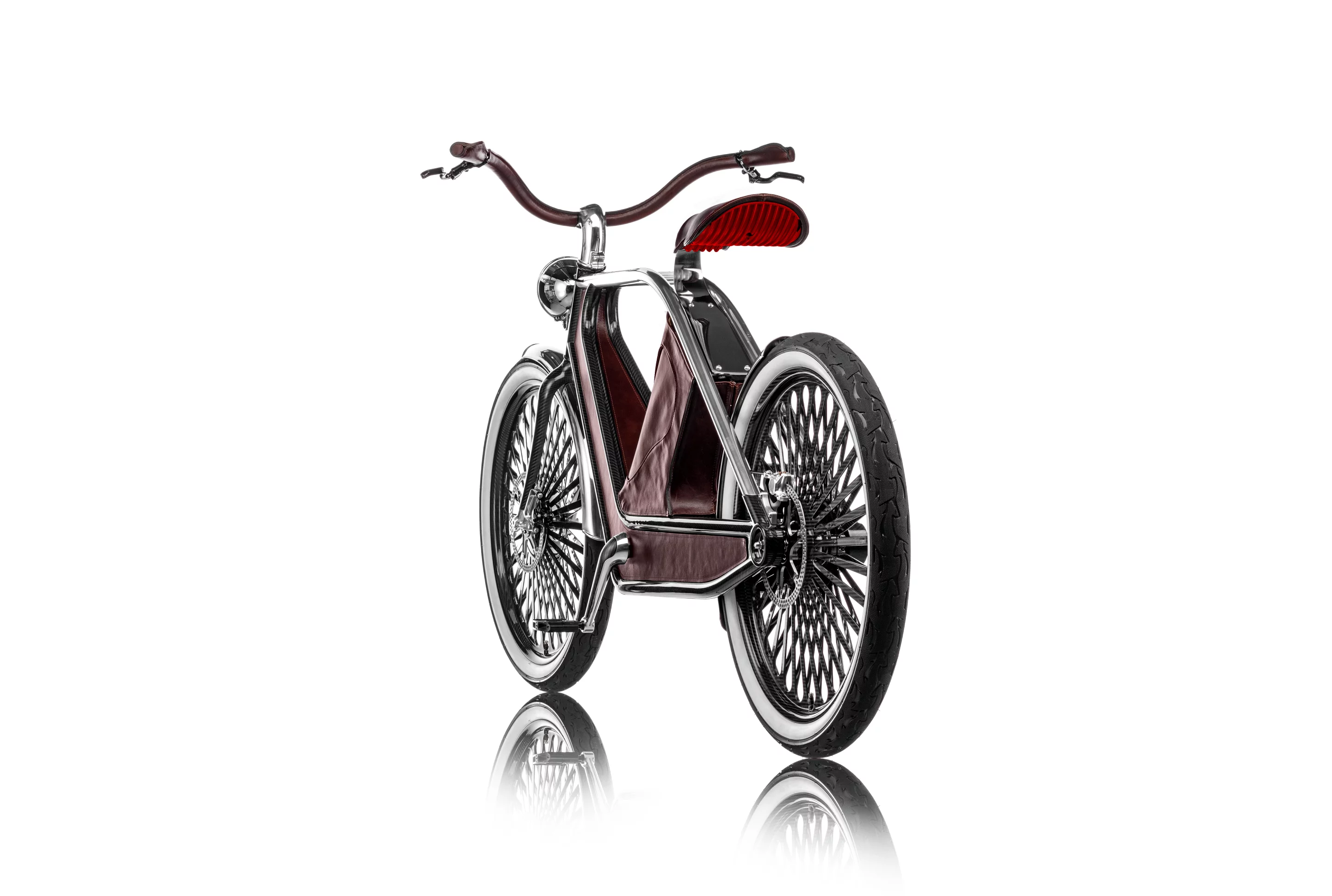 The centrally-mounted electric motor sits on a carbon fiber cradle