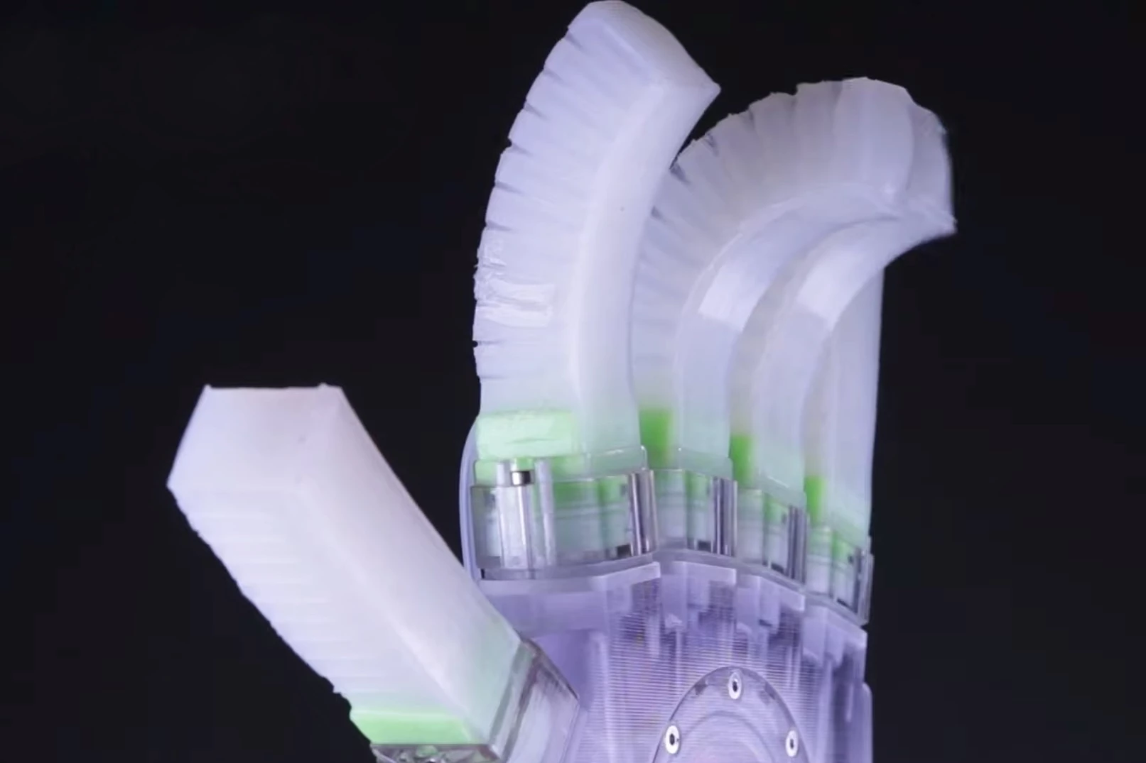 Hysteretic valves in this soft robotic hand allow it to sequentially thrum its fingers