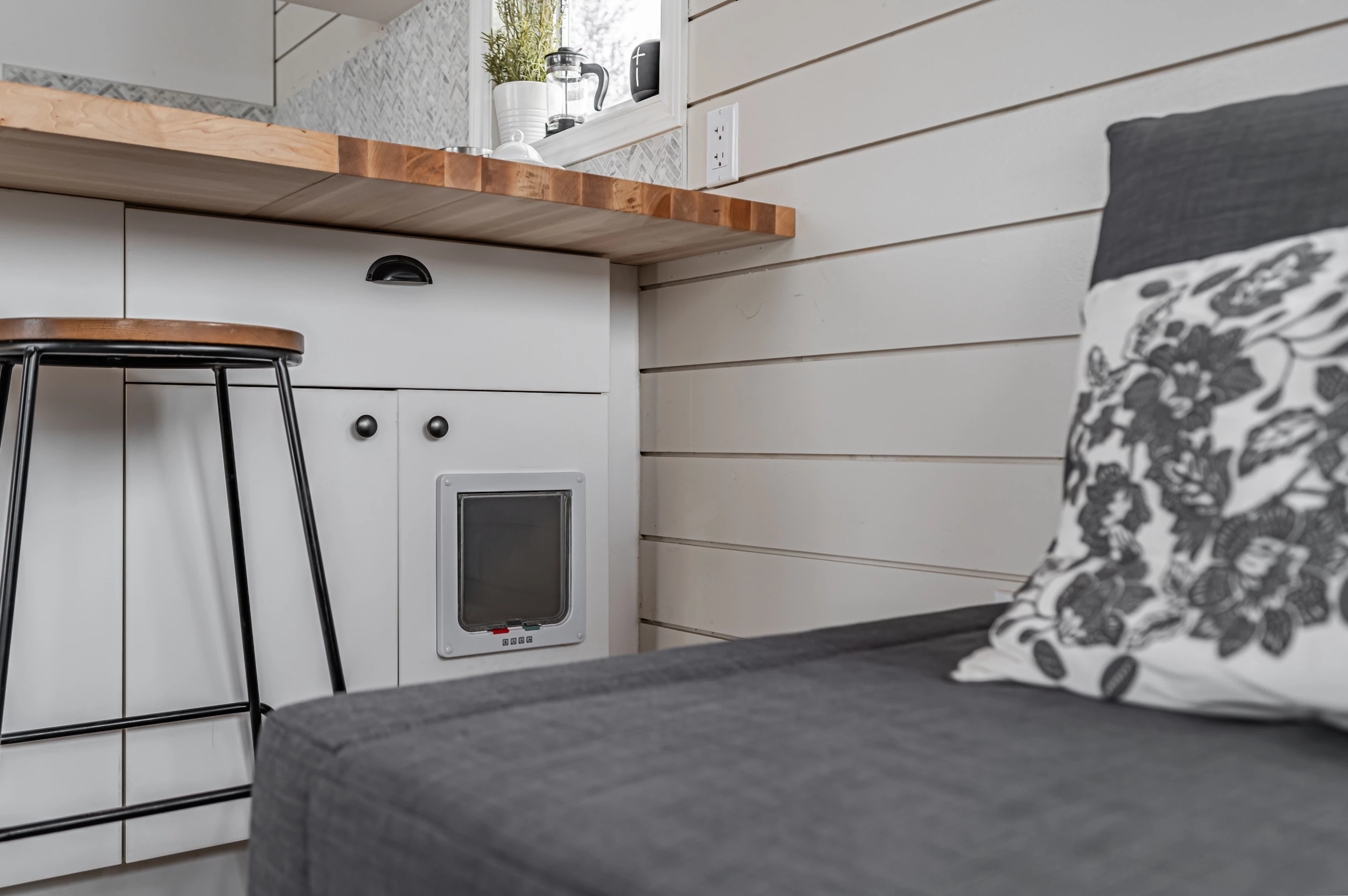 The Paddock Paradise's kitchen includes a cat litter tray hidden in the cabinetry