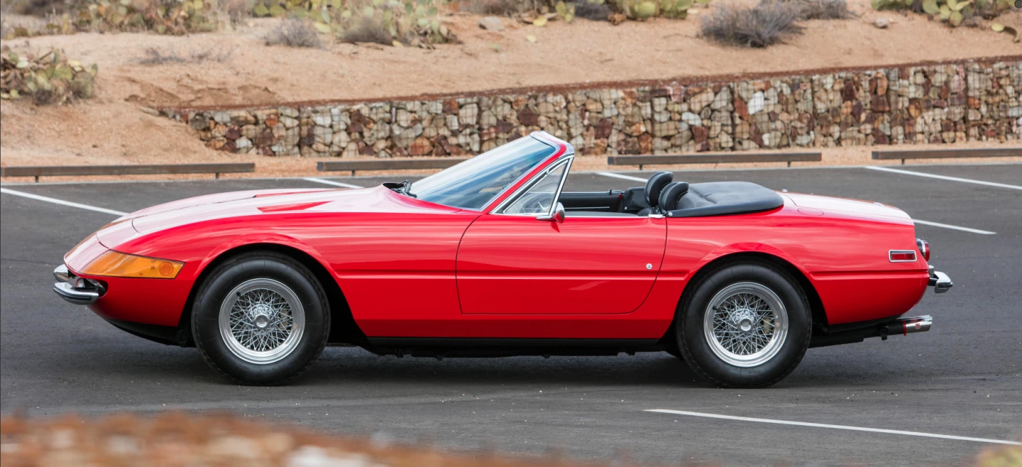 The Ferrari 365 GTB/4 debuted at 1968 Salon de l'Automobile in Paris, and was initially dubbed the "Daytona" by the media following Ferrari's 1-2-3 whitewash of the 1967 24 Hours of Daytona. When production commenced, the 365 GTB/4 immediately became the world's fastest road going car with a run of 174 mph. The convertible Daytona arrived at the 1969 Salon de l'Automobile with deliveries commencing in 1971. In all, 1,400 Berlinetta Coupes were built, but the Spider is a much more elusive beast, with a total production of just 123 units. This car is the 72nd example of the 123 and sold with a detailed history for $2,640,000 at Bonham’s Scottsdale 2018 auction