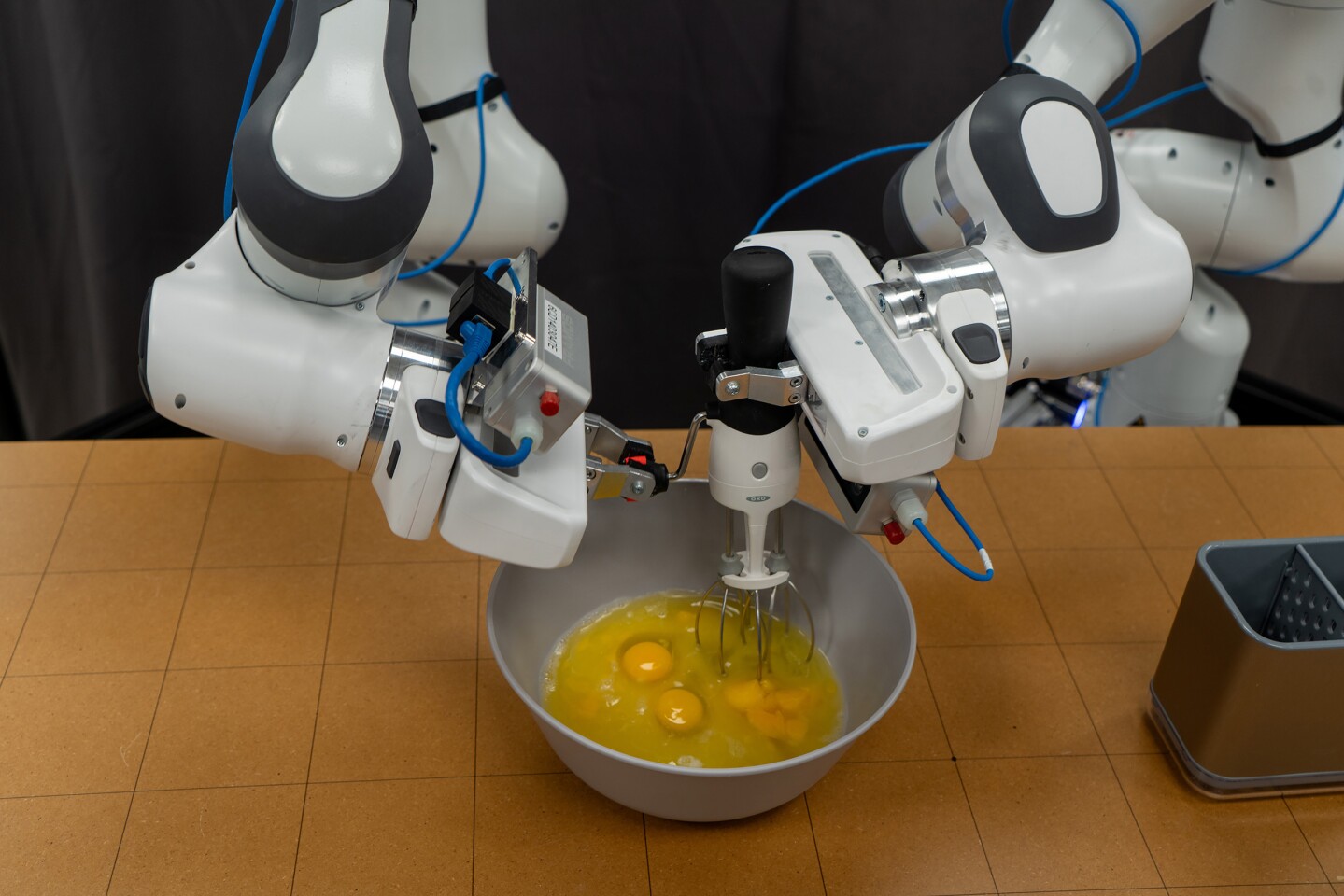 The new learning system is mastering a range of complex two-handed tasks involving tools, like this egg beater