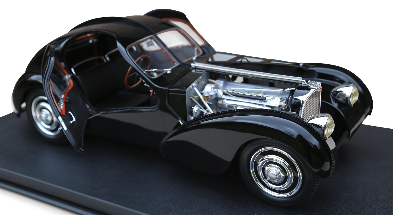 Number 12 of a limited edition of 99 one eighth scale models of a 1938 Bugatti 57 SC Atlantic model commissioned by Ralph Lauren. Lauren is one of just three people in the world to own a real Bugatti 57 SC Atlantic, which just coincidentally, is a black one and can be seen here. This model sold for $19,134 (€15,625)