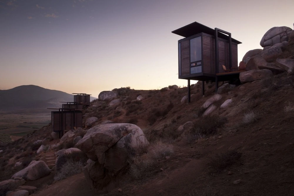 Designed by San Diego based architects Gracia Studio, each cabin is set privately along the sloping hillside