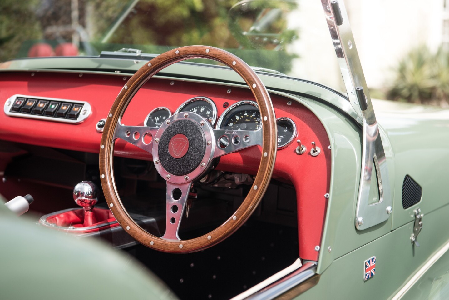 The wood rimmed steering wheel is a lovely throwback touch