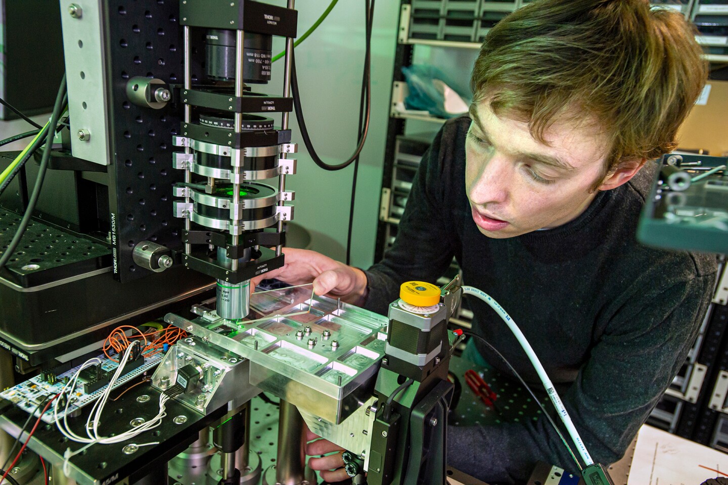 Data stored on the glass slides can be read back using a computer-controlled microscope
