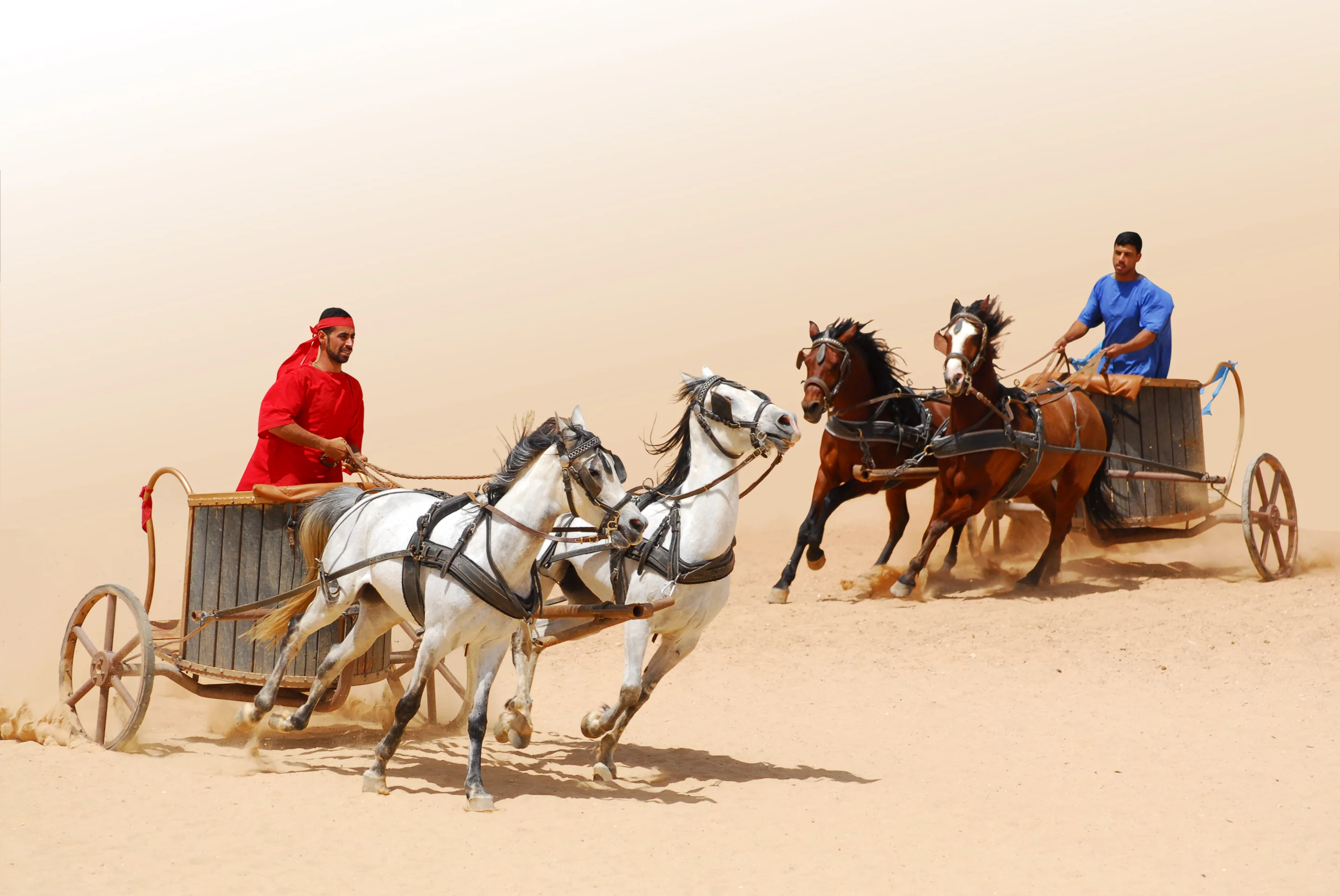 Roman warriors racing with horses and chariots carts during Roman show in Jerash, Jordan Regien Paassen / Shutterstock.com