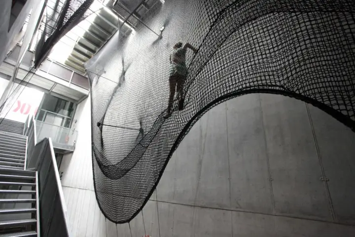 Net Linz is a rope-based installation at the OK Center for Contemporary Art, that people can climb as a means of moving between floors