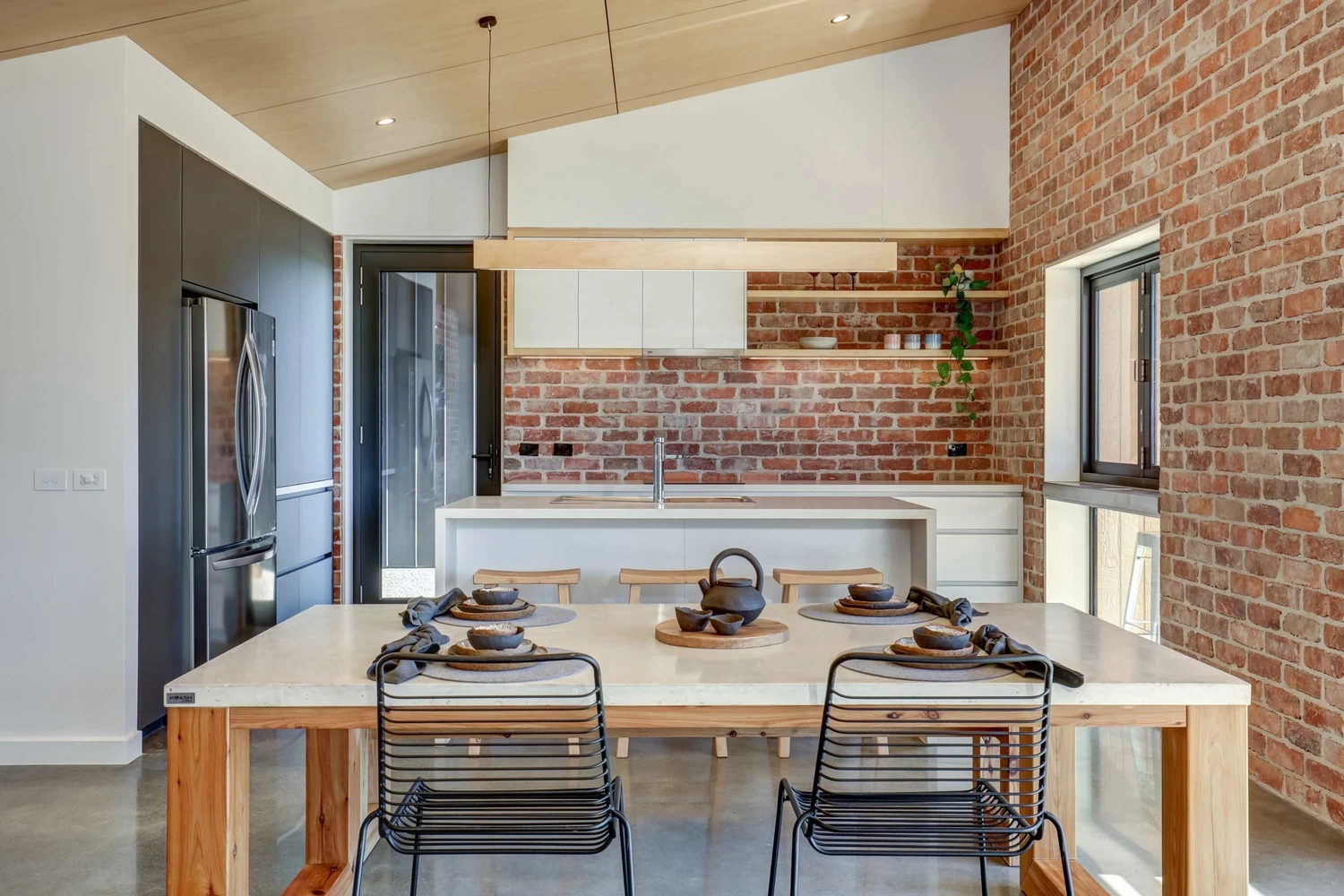 The CORE 9 prototype is a 131-square meter (1,410-sq ft) family home and features a modern kitchen and dining area