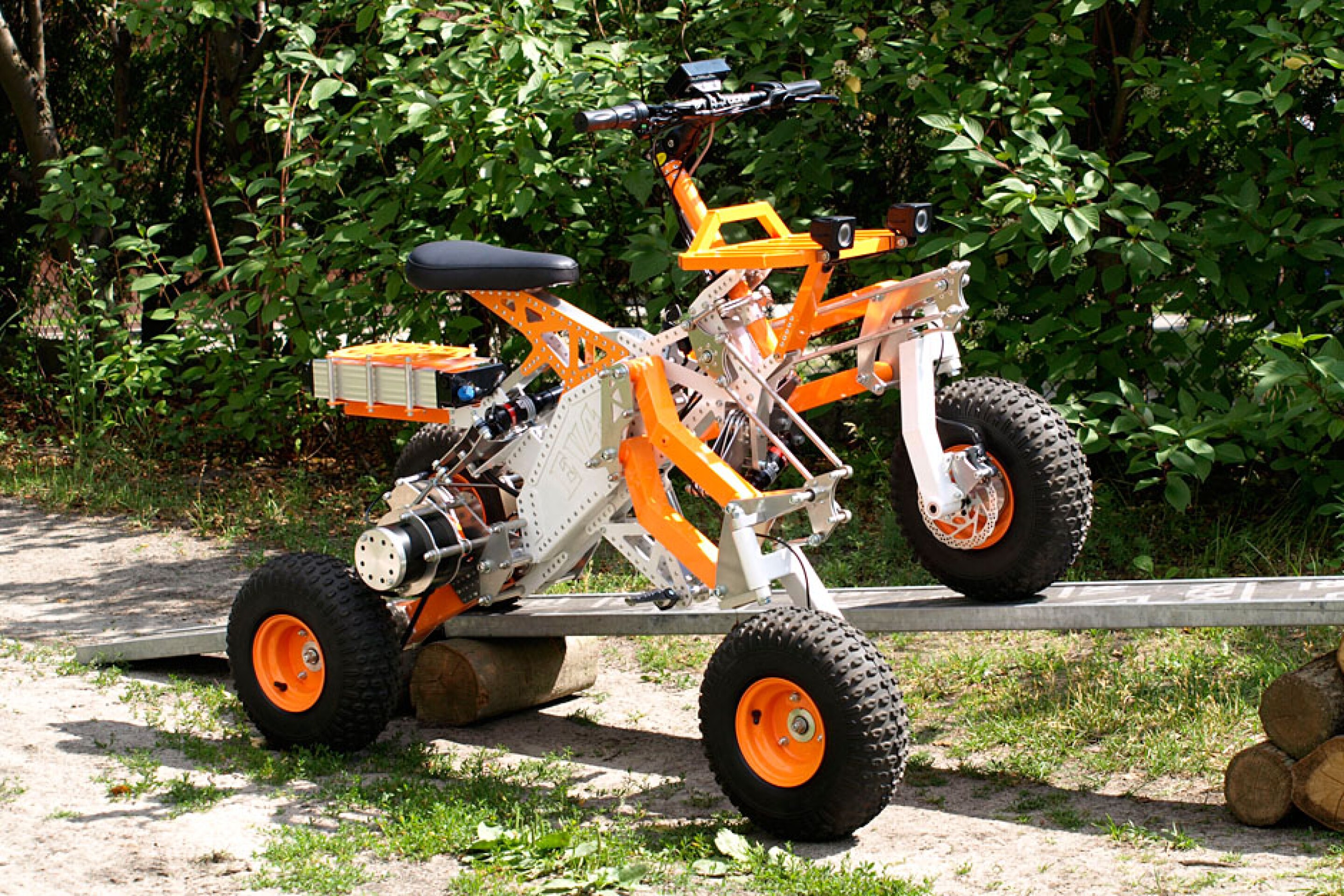 Tilting electric quad gets menacing offroad big brother
