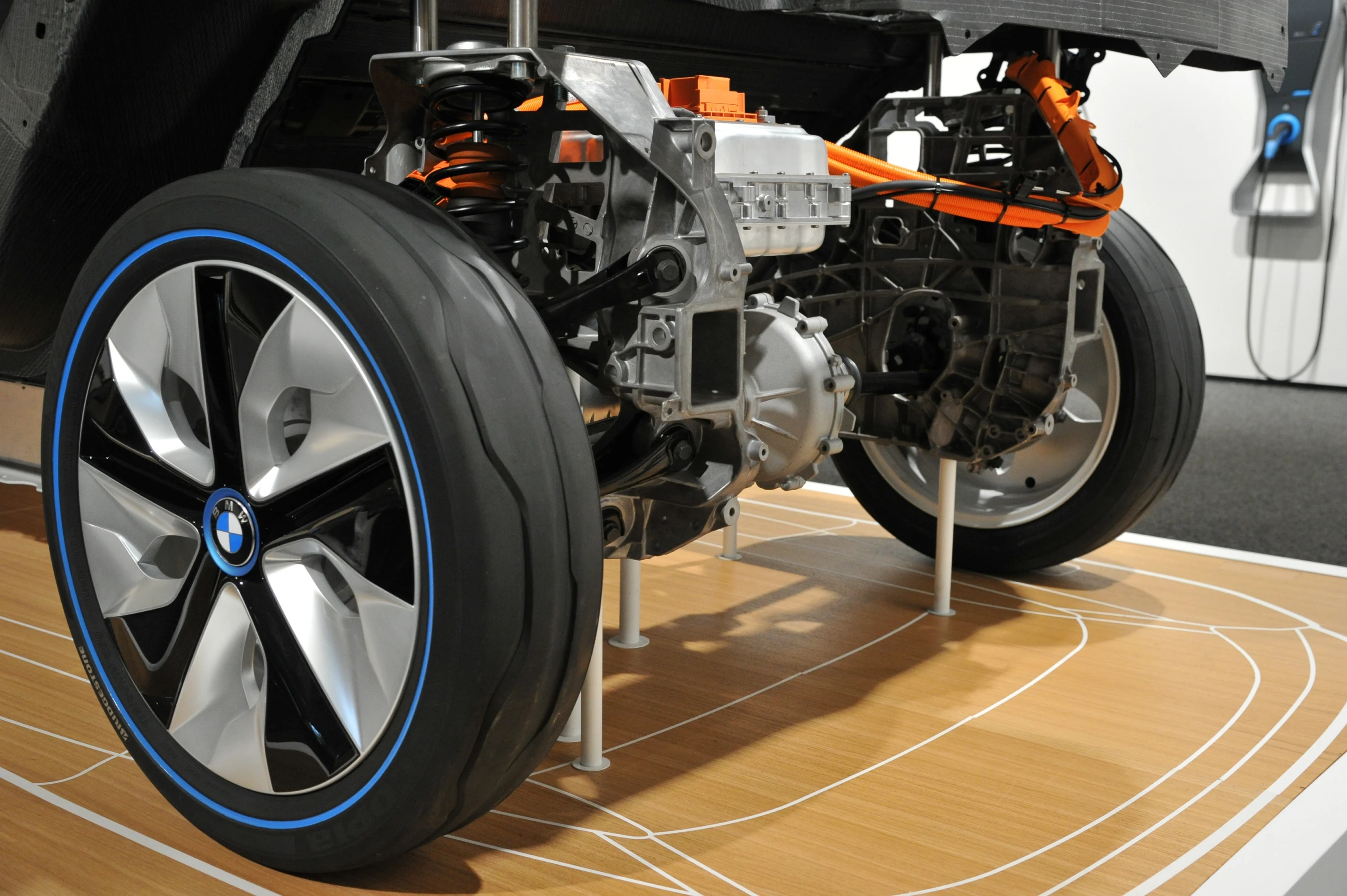 The i3's electric motor mounted over the rear axle, incorporates the power electronics, transmission and differential