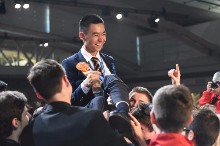 Raymond Wang, the 17-year-old Canadian first place winner at the 2015 Intel International Science and Engineering Fair, celebrates among his fellow finalists
