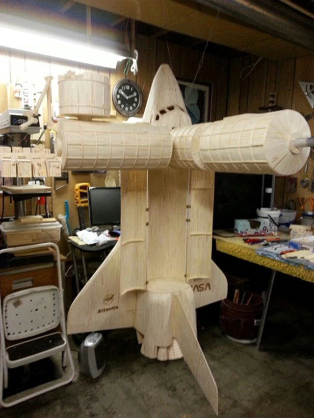Acton also built a scaled down version of the Space Shuttle Atlantis to go with the station