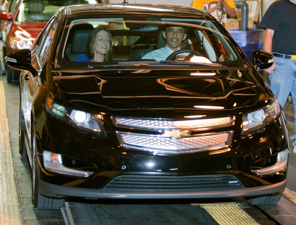 President Barack Obama drives a 2011 Chevrolet Volt electric vehicle off the line with Plant Manager Teri Quigley in the passenger seat at the General Motors Detroit-Hamtramck Assembly Plant