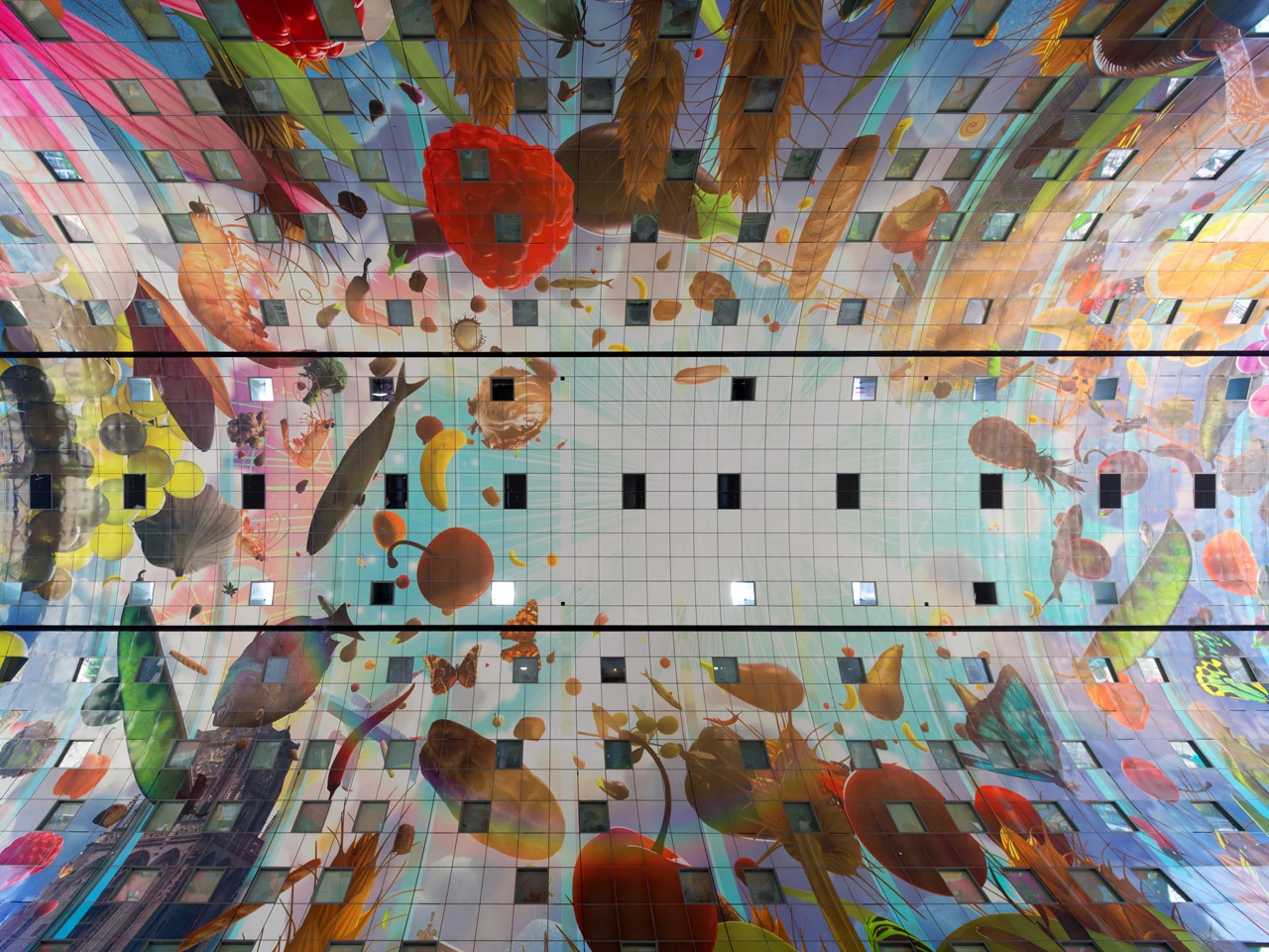 The Markthal mural depicts oversized images of market produce which can be bought at the market