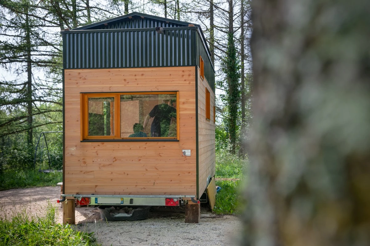 The Tiny House Franck is clad in Douglas fir, with black polycarbonate accenting