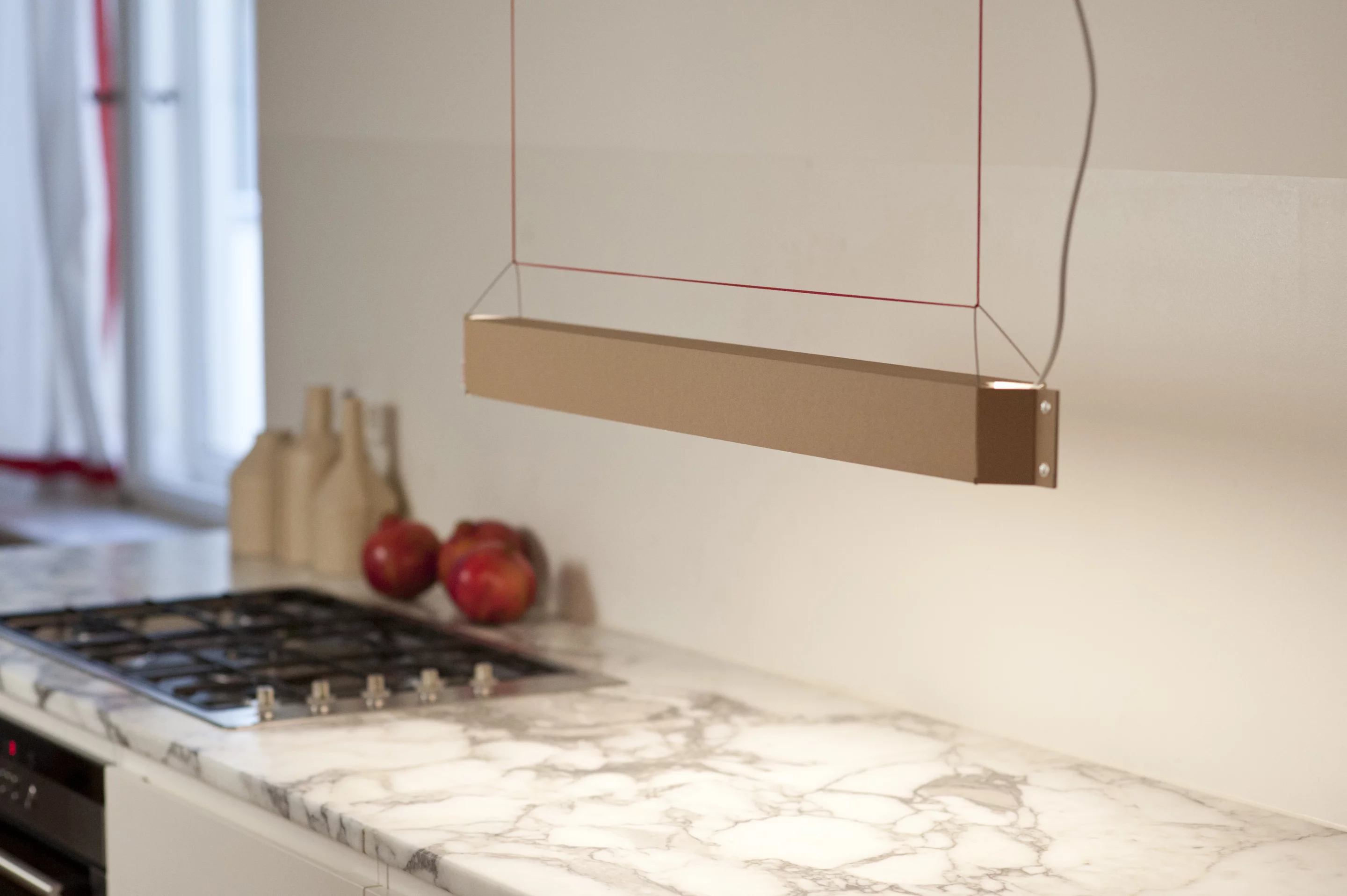 The lamp hangs from the ceiling and can be suitable for the kitchen, dining room, home workspace or office