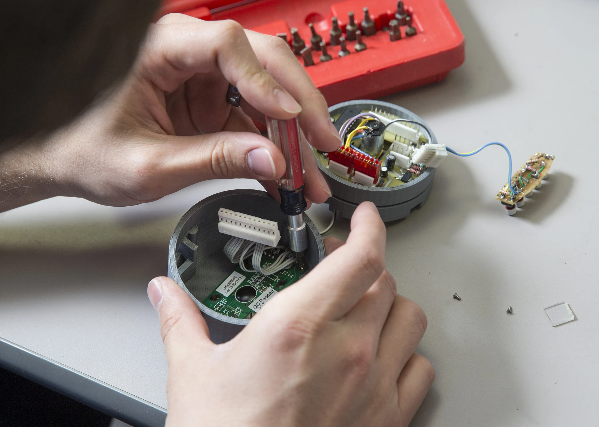 A student works on the Med Vault's electronics