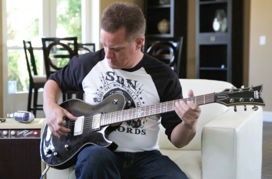 Livermore-based guitarist Brandon McCullough tries out the Dialtone "infinitely adjustable pickup"