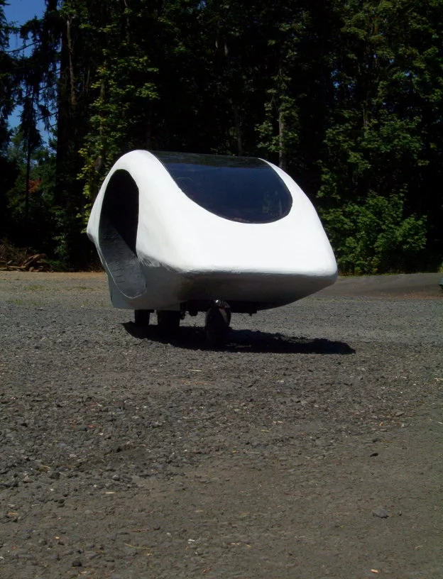 The Thrustcycle SRT is a three-wheeled vehicle that incorporates a gyro/flywheel system to maintain its balance, and harvest power from braking