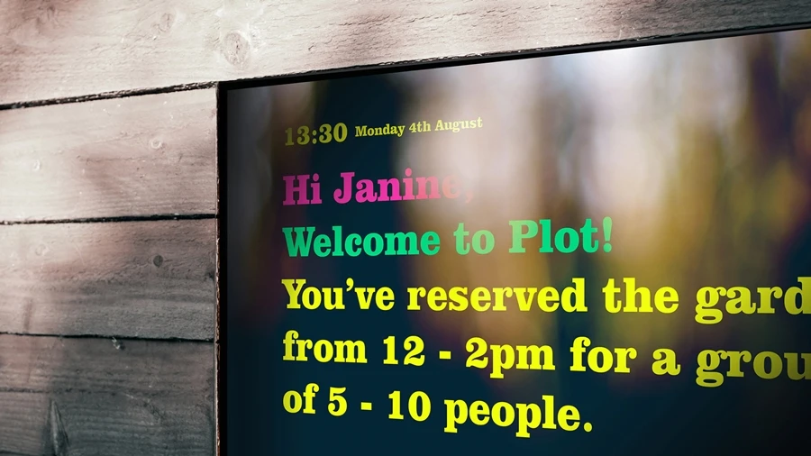 A welcome board provides details for people as they arrive at the Plot garden