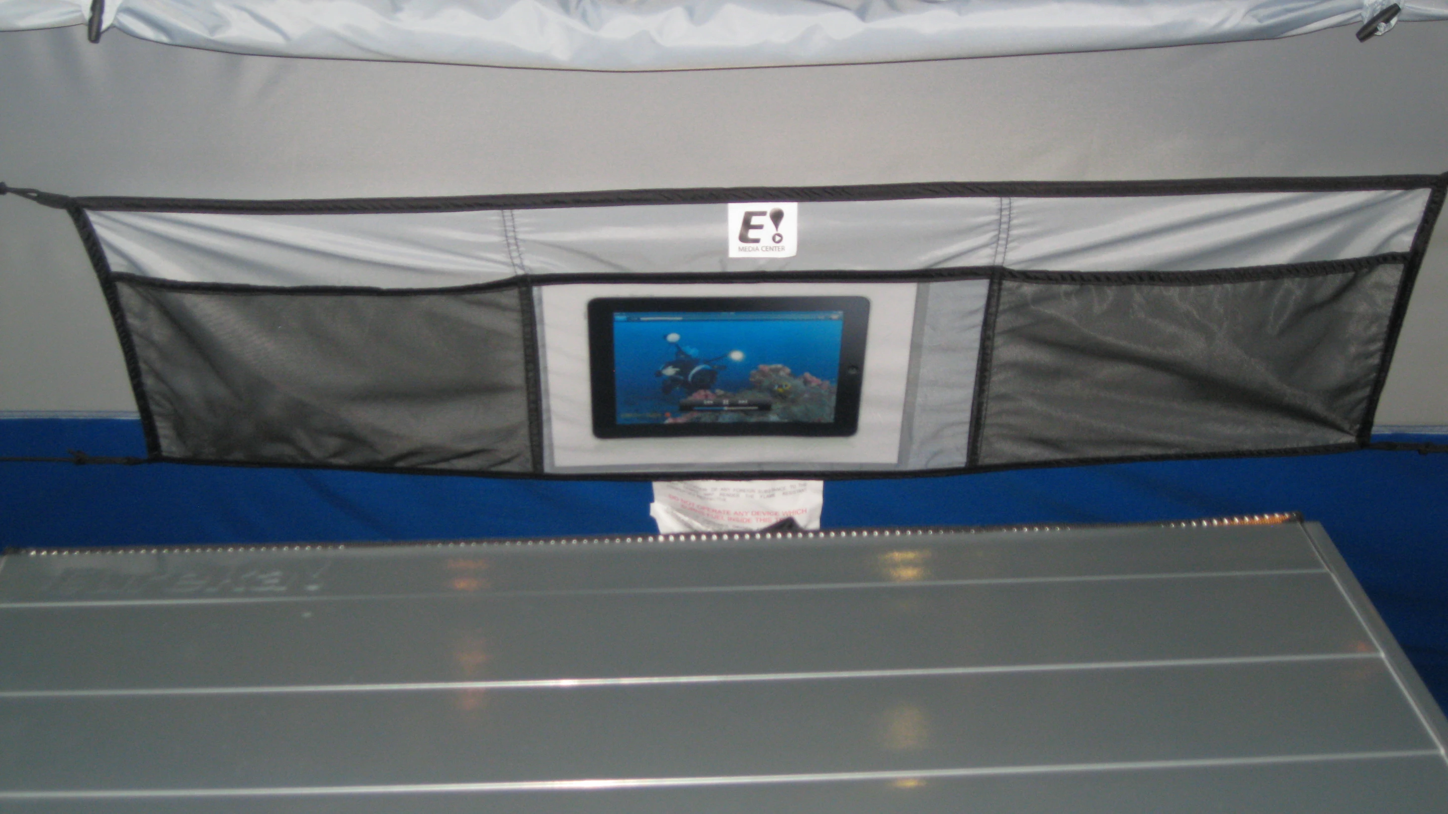 The Eureka E Media Center is a family-friendly feature that lets you mount an iPad or tablet on the tent wall, like the flat-screen at home