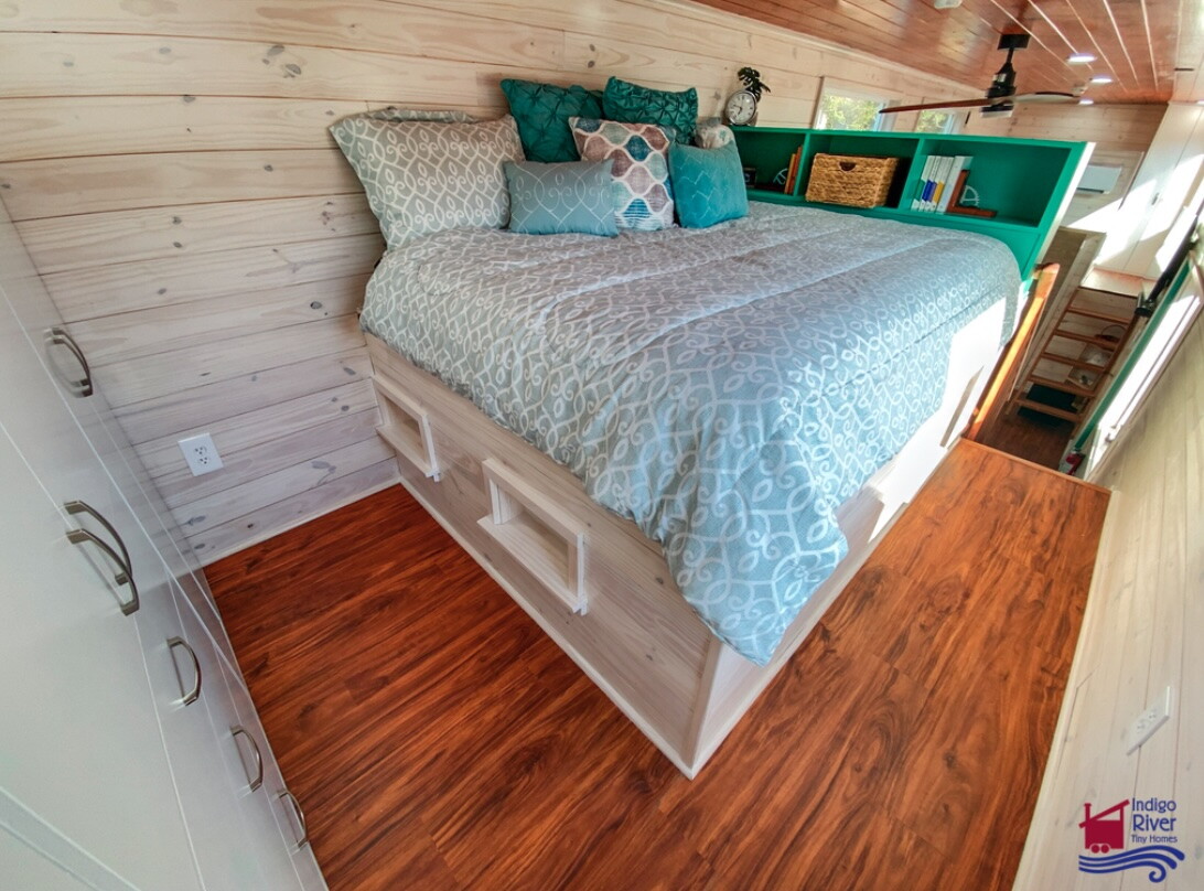 The Sandy tiny house's upstairs bedrooms have a ceiling height of 6.4 ft (1.95 m) thanks to their lowered standing platforms