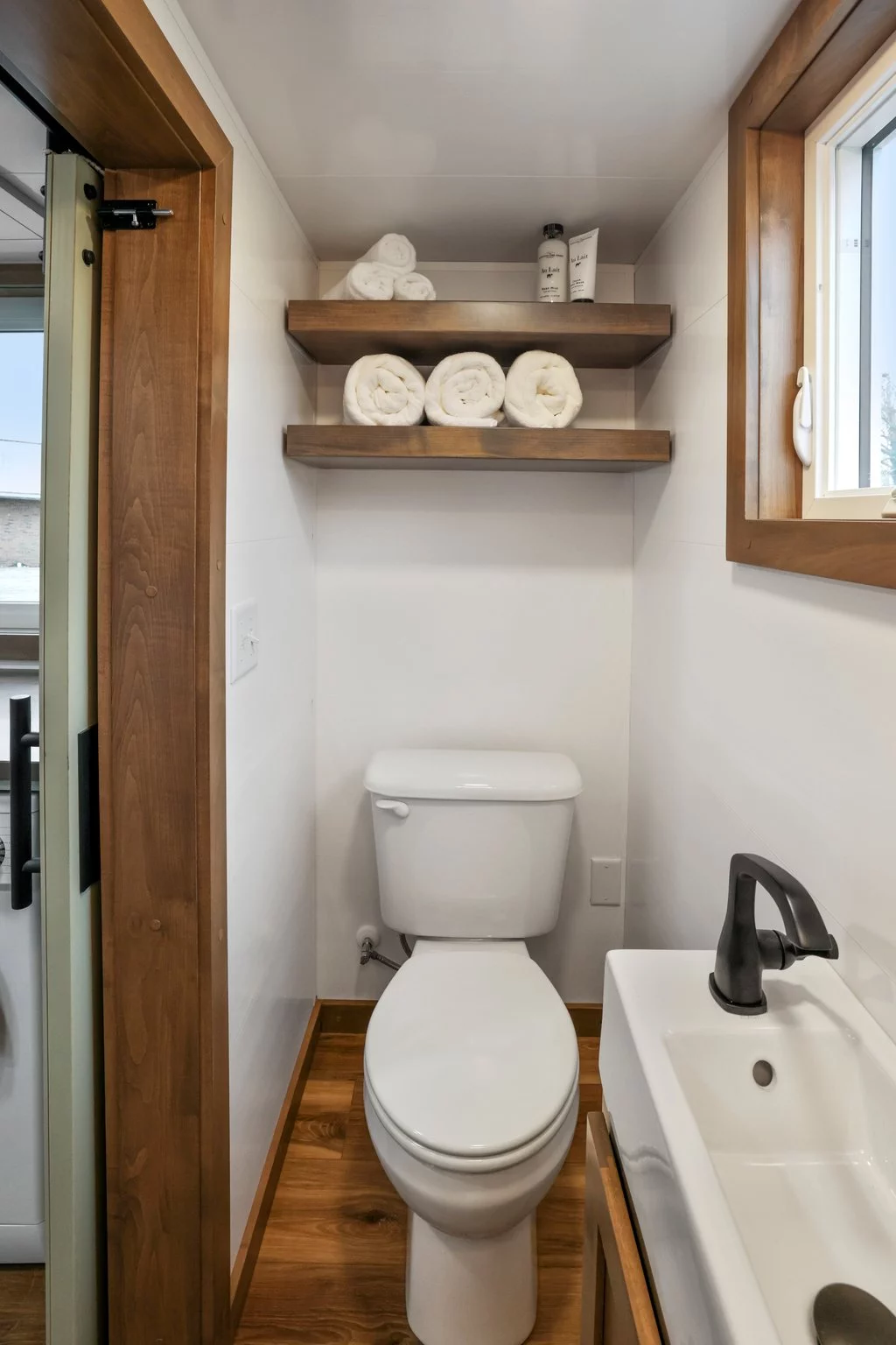The Bofin's bathroom is small but Modern Tiny Living managed to squeeze in a shower, toilet, and sink