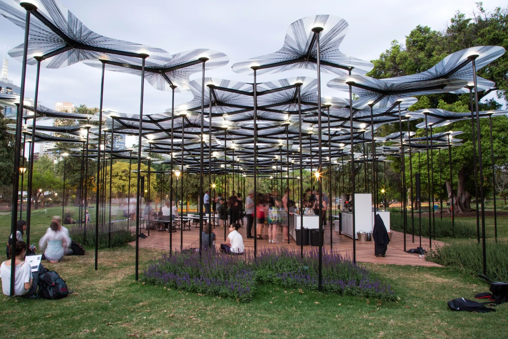The designer, award winning British architect Amanda Levete, set out to "create a sensation of a forest canopy in the heart of the city that gives shelter to a program of events"