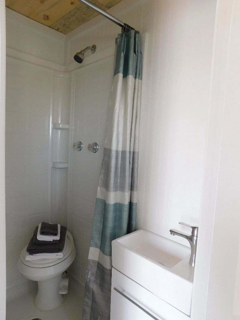 Unfortunately, due to size constraints, the Ozark's toilet is located in the shower